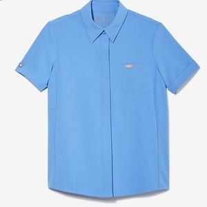 FIGS scrub top (holding)